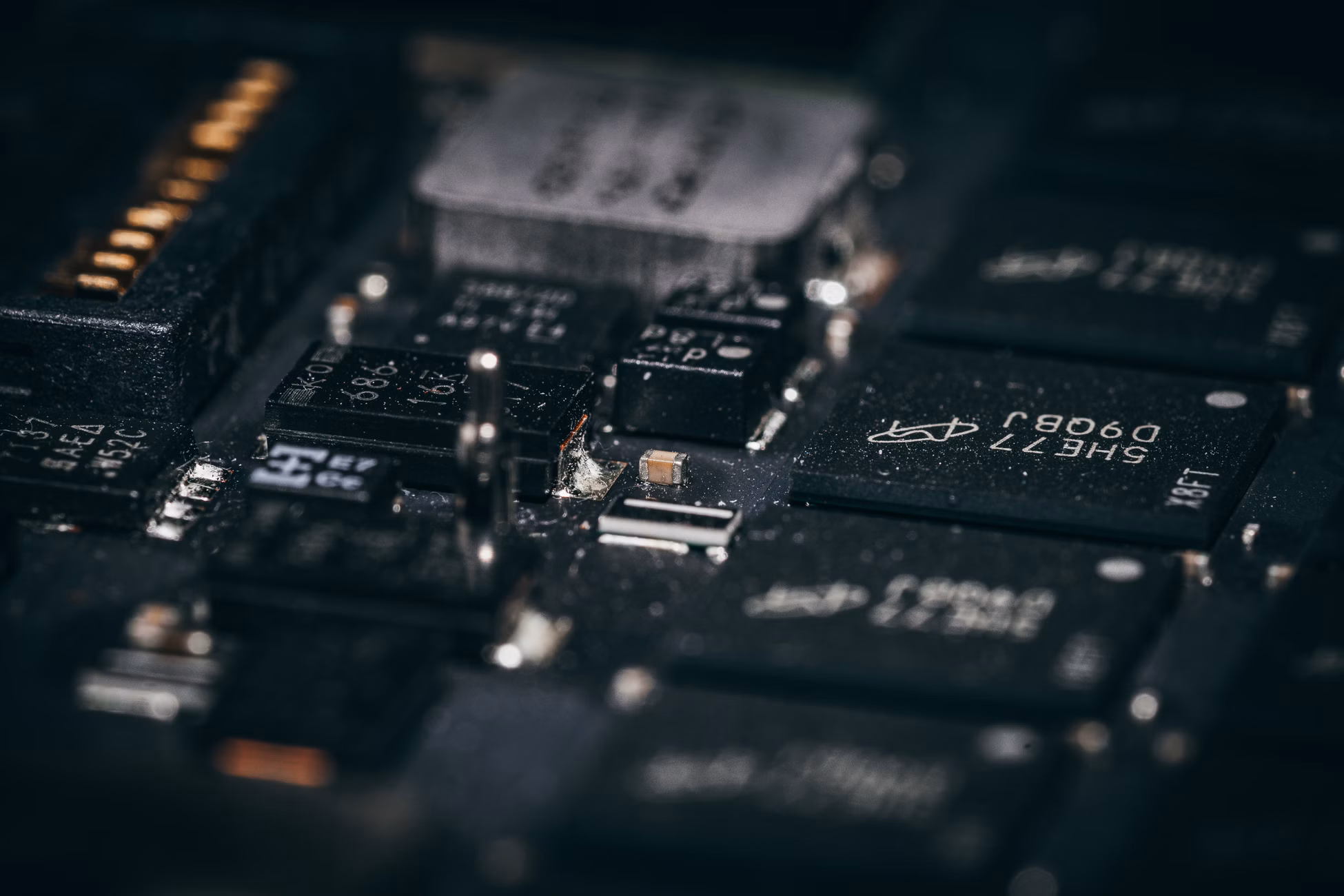 Detailed macro shot of electronic circuit components showcasing intricate design and layout.