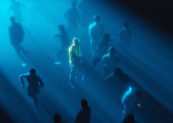 Surreal urban crowd scene with dramatic lighting focusing on a solitary figure.