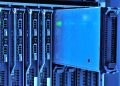 Detailed view of server racks with glowing lights in a data center environment.