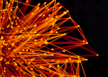 Vibrant orange lines and dots form an abstract network on a dark background, evoking technology and connectivity.