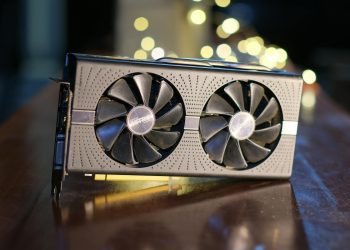 Close-up of a high-performance graphics card with decorative LED lights in the background.