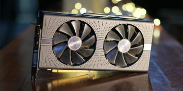 Close-up of a high-performance graphics card with decorative LED lights in the background.