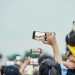A lively crowd capturing an event on smartphones, showcasing modern digital engagement.