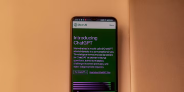 A smartphone showing the ChatGPT interface, emphasizing technology and AI indoors.