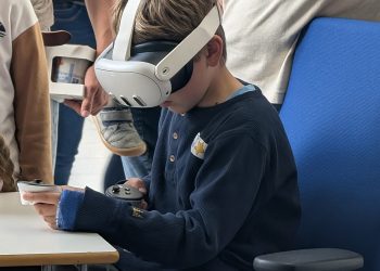 Visitor using a Meta Quest 3 VR headset at IPP Greifswald 2025