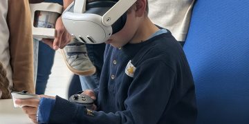 Visitor using a Meta Quest 3 VR headset at IPP Greifswald 2025