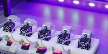 Detailed close-up of CNC laser units with glowing controls, ready for precision tasks.