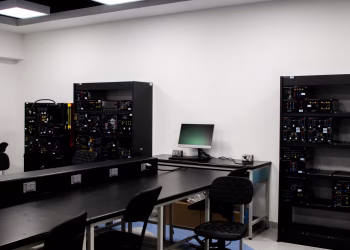 A contemporary electronics lab featuring workstations and technical equipment.