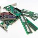 A detailed close-up of computer RAM sticks and PCI cards arr
