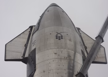 Detailed view of a space shuttle's bottom side showcasing its metallic surface and structure.