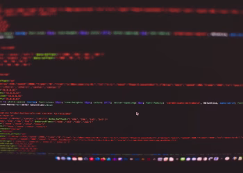 Close-up view of colorful CSS and HTML code displayed on a dark computer screen.