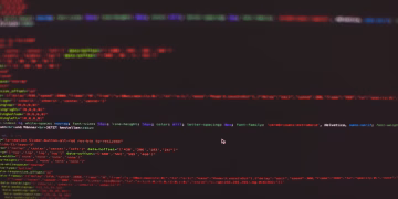 Close-up view of colorful CSS and HTML code displayed on a dark computer screen.