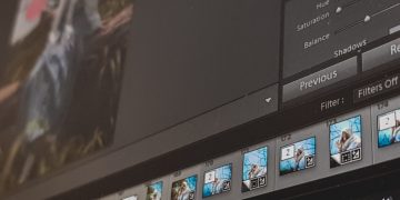 black laptop computer turned on displaying facebook
