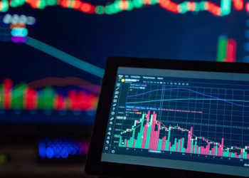 Colorful trading charts showing cryptocurrency market trends on a computer screen.