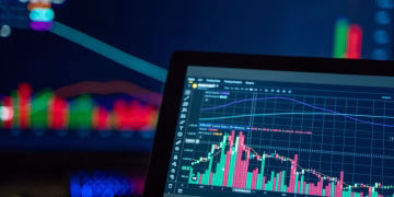 Colorful trading charts showing cryptocurrency market trends on a computer screen.
