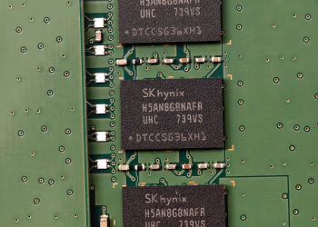 Detailed view of SK hynix DRAM chips on a green circuit board featuring electronic components.