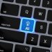a computer keyboard with a blue light on it