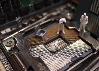 Tiny CSI figures conduct an investigation on a CPU, blending technology with creativity.