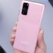 person holding rose gold iphone 6 s