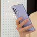 person holding white and blue iphone case