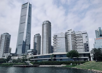 Modern skyscrapers of Shenzhen skyline by the waterfront on a cloudy day.