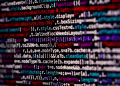 Close-up of multicolored code on a computer screen, highlighting programming.