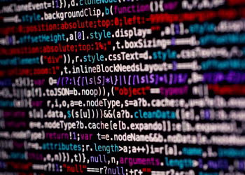 Close-up of multicolored code on a computer screen, highlighting programming.