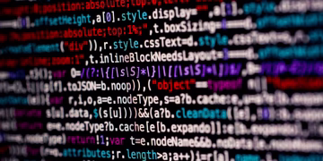 Close-up of multicolored code on a computer screen, highlighting programming.