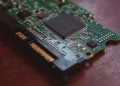 Detailed shot of a computer circuit board showing components and golden pins.