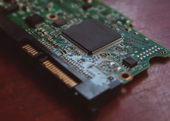 Detailed shot of a computer circuit board showing components and golden pins.