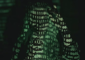 An unrecognizable person with binary code projected, symbolizing cybersecurity and digital coding.