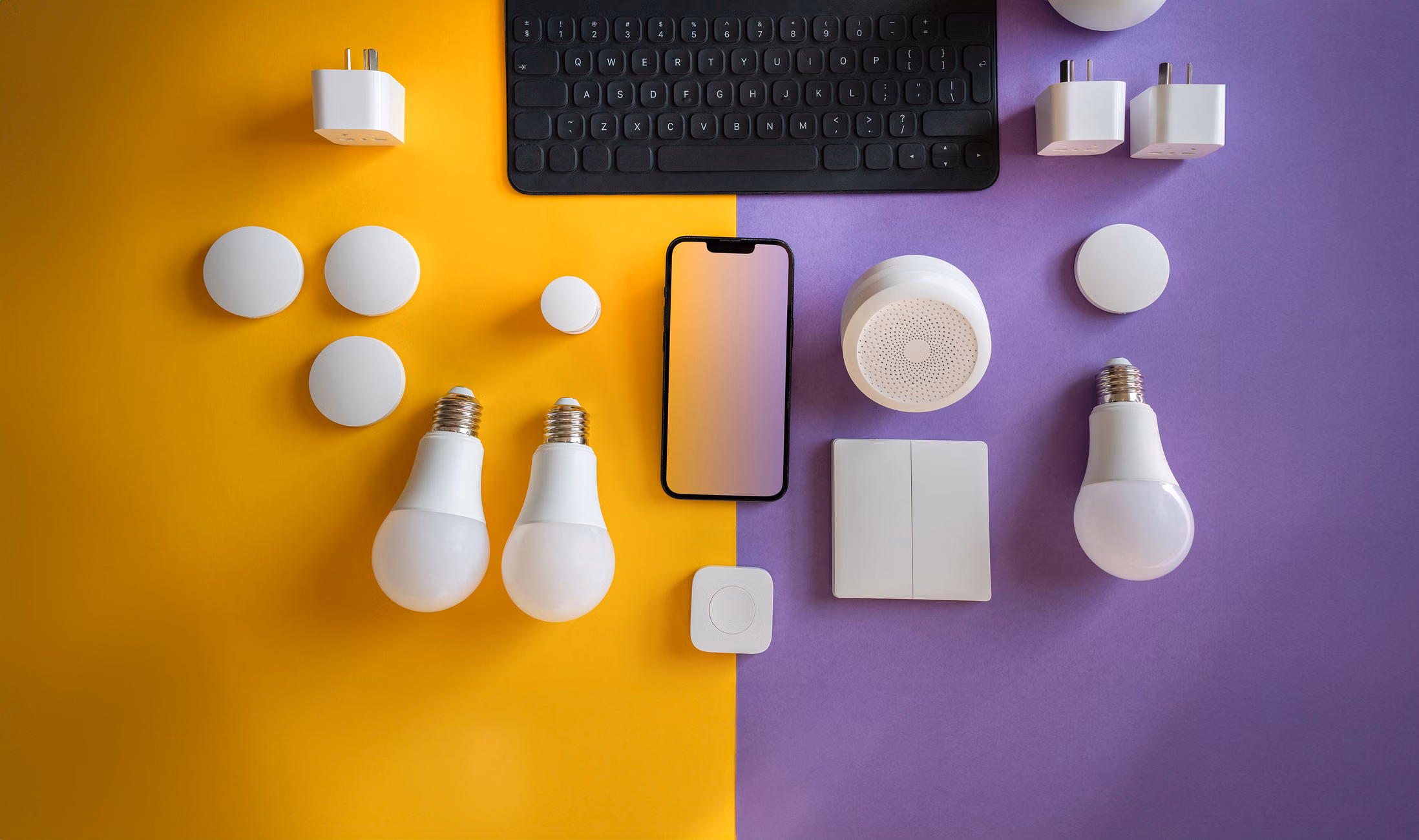 Flat lay of electronics, smart home gadgets on a colorful background for tech concepts.