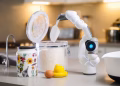 A robotic arm measuring flour on a modern kitchen counter, highlighting innovation in technology.