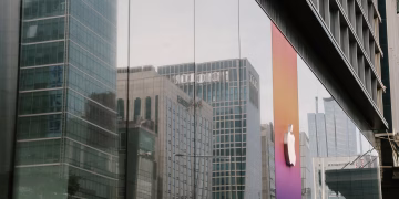 A city's reflection in a modern glass building facade capturing urban architecture and corporate design.