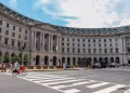 Street view of a historic building in Washington, DC, showcasing architecture and urban life.