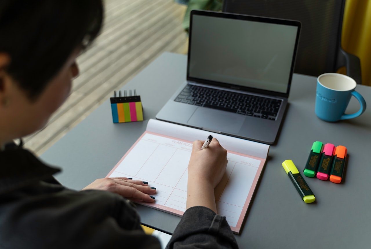 a man writing on a piece of paper