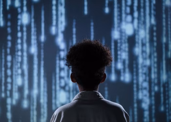 A young boy viewing a digital screen with data streams, symbolizing technology interaction.