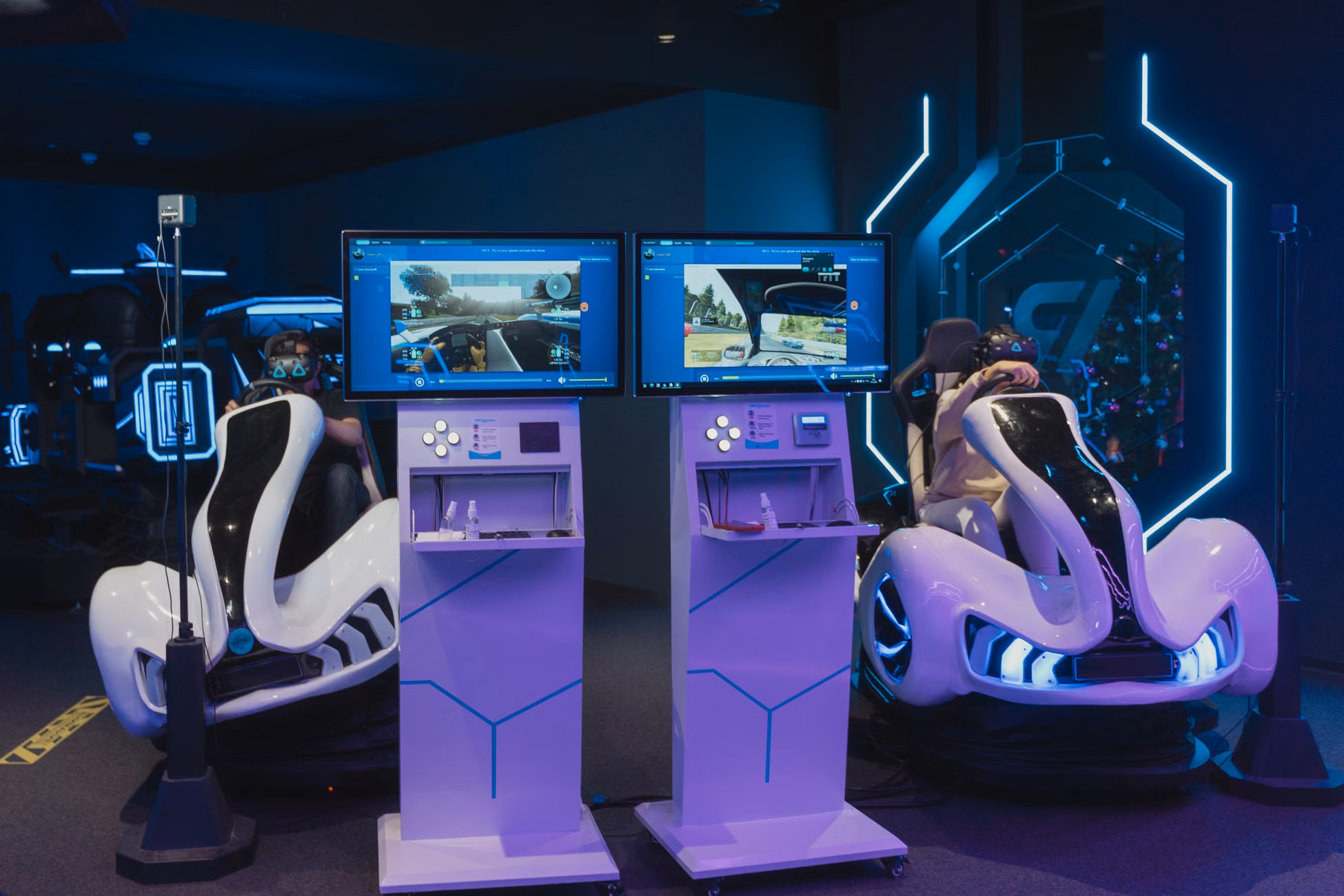 Futuristic gaming chairs with VR headsets and monitors, capturing immersive gameplay in a modern arcade.