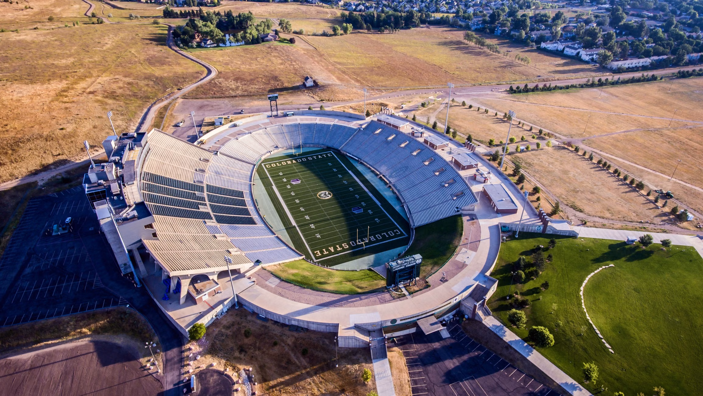 Captivating aerial shot of Hughes Stadium in Fort Collins, showcasing its modern design and scenic surroundings.