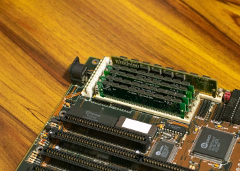 Detailed image of a vintage computer motherboard with RAM sticks.