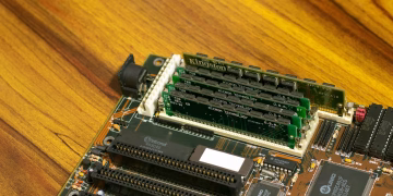 Detailed image of a vintage computer motherboard with RAM sticks.