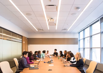 A multicultural team brainstorming and collaborating during a business meeting.