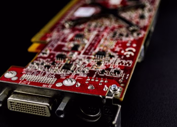 Detailed close-up of a red circuit board showcasing electronic components.