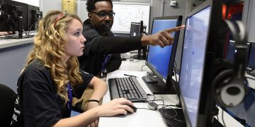 Sailor helps a high school student, complete cybersecurity challenges. (32378784741)