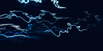 Dynamic abstract design of blue light streaks over black backdrop, capturing movement.