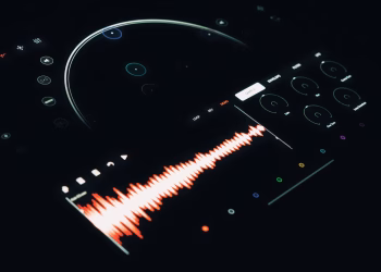 Close-up of a digital audio interface displaying a vibrant sound wave and control elements.