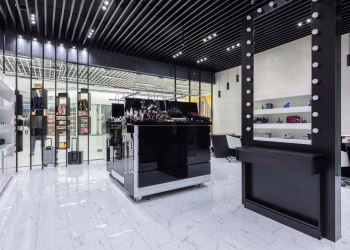 Sleek modern interior of a beauty store with cosmetics and chic decor.
