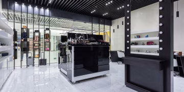 Sleek modern interior of a beauty store with cosmetics and chic decor.