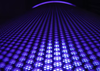 A captivating abstract image featuring glowing purple spheres in a dynamic pattern.