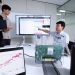 브로드컴 와이파이 8 시험 장비를 놓고 홈 네트워크 품질 데이터를 검토하는 LG유플러스 연구진